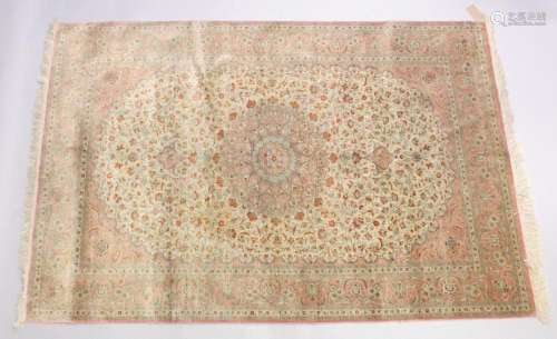 A GOOD SHIRVAN SILK RUG, pink ground with all over floral de...