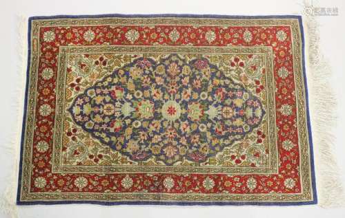 A GOOD SMALL SHIRVAN SILK RUG, blue ground with floral decor...