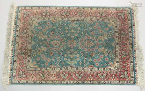 A GOOD SMALL SHIRVAN SILK RUG turquoise ground with floral d...