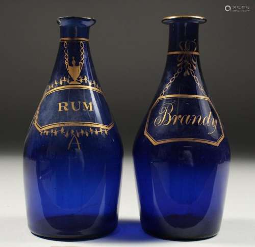 TWO BRISTOL BLUE DECANTERS  RUM  and  BRANDY . 7ins high (on...