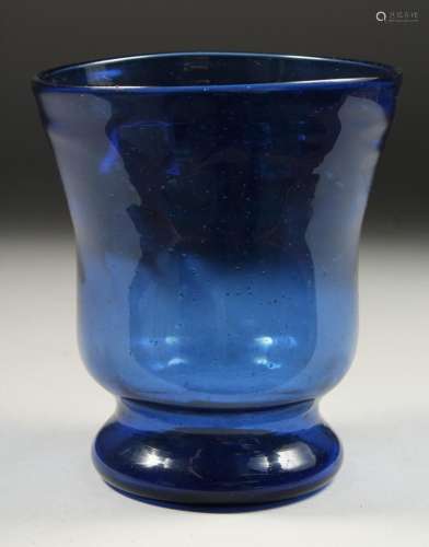 AN OLD BLUE GLASS VASE. 5.5ins high.