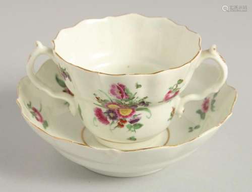 AN 18TH CENTURY WORCESTER POLYCHROME CHOCOLATE CUP AND SAUCE...