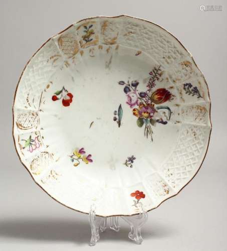 A MEISSEN PLATE painted with flowers. Cross swords mark in b...