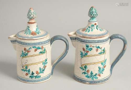 A PAIR OF 19TH CENTURY TIN GLAZE JUGS AND COVERS with pineap...