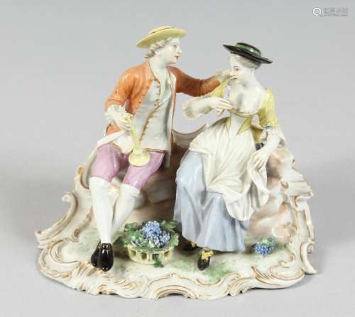 A GOOD FURSTENBERG PORCELAIN GROUP of a young man and girl s...