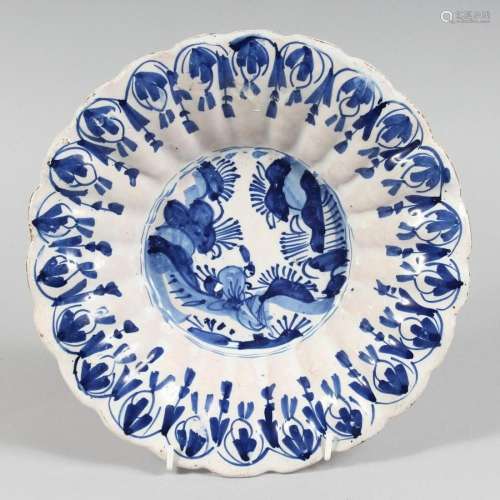 A 19TH CENTURY BLUE AND WHITE DEEP CHARGER with Chinese desi...