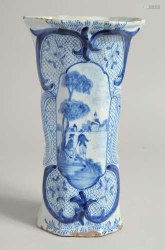 A DUTCH BLUE AND WHITE TIN GLAZE VASE with figures in a land...