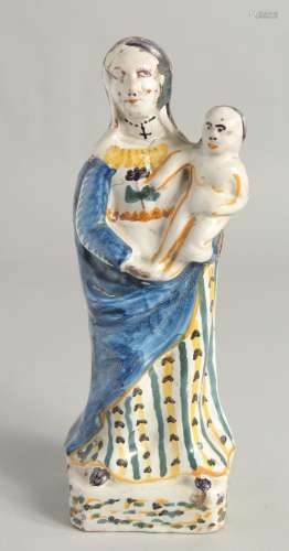 AN 18TH CENTURY FIANCE POTTERY FIGURE, Madonna and child. 12...