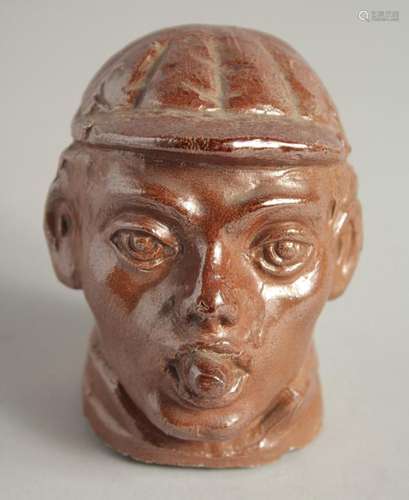 A SALTGLAZE HEAD OF A BOY. 4ins high.