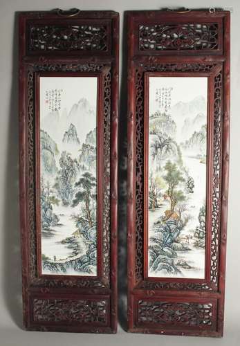 A PAIR OF LONG FRAMED CHINESE WALL PLAQUES.