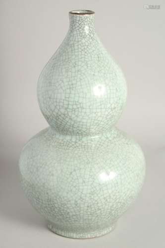 A CHINESE DOUBLE GOURD CELADON VASE. 1ft 3ins high.