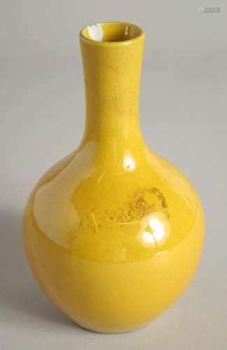 A CHINESE YELLOW PORCELAIN VASE. 7ins high.