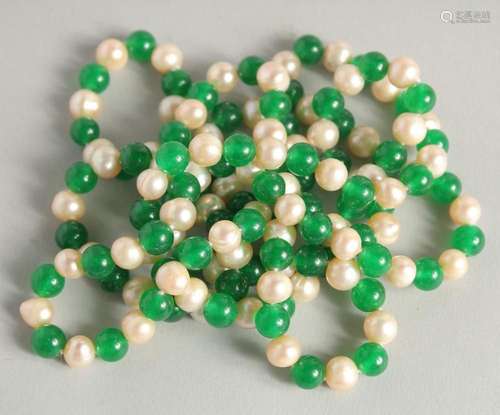 A STRING OF JADE AND PEARL BEADS. 48ins long.