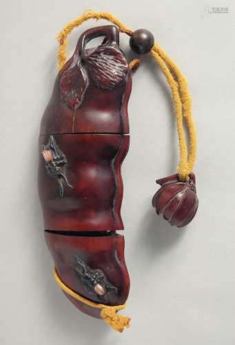 A LARGE CARVED WOOD FRUIT INRO. 7ins long,