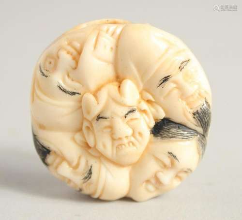 A CHINESE CARVED BONE NETSUKE. 1.5ins diameter.