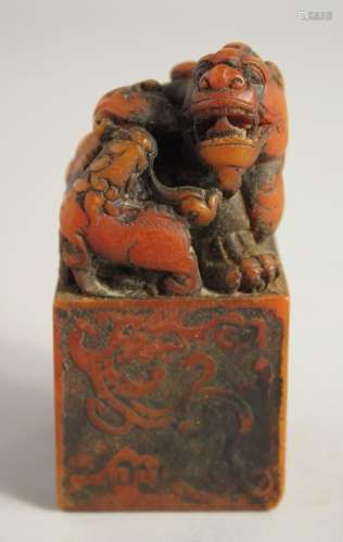 A CHINESE CARVED SOAPSTONE DRAGON SEAL. 4ins high.