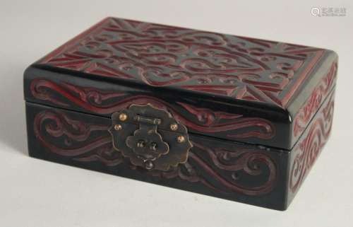 A CHINESE LACQUERED WOOD RECTANGULAR BOX with carved decorat...