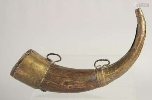 A BOVINE HORN POWDER FLASK with brass mounts. 28cm long