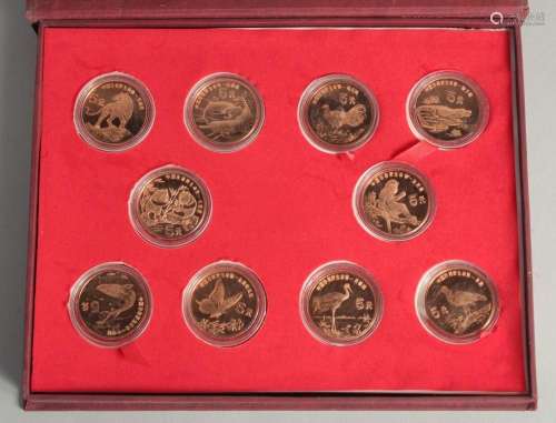 A COLLECTION OF TEN CHINESE COINS in presentation box.