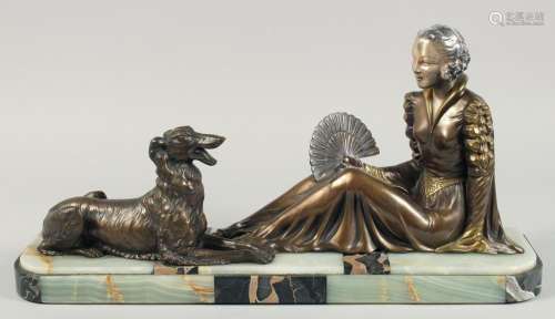 A VERY GOOD ART DECO BRONZE GROUP OF A LADY SEATED HOLDING A...