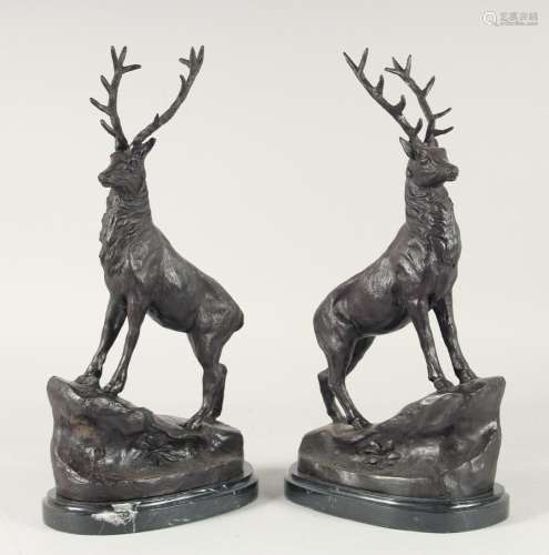 AFTER J MOIGNIEZ A PAIR OF BRONZE STAGS on an oval marble ba...