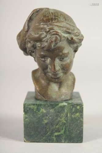 A SMALL BRONZE OF A BOY. 3.5ins long on a marble base