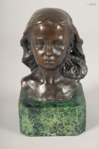 A SMALL BRONZE OF A GIRL. 4.5ins long on a marble base.