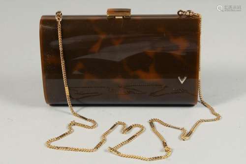 A FAUX TORTOISESHELL EVENING PURSE with long gilt chain. 7in...