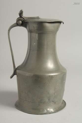 A LARGE 18TH CENTURY NORMANDY JUG AND COVER. 10ins high.
