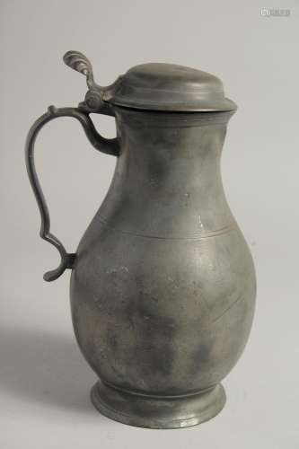 AN 18TH CENTURY PEWTER FLEMISH PEWTER FLAGON AND COVER. 11in...