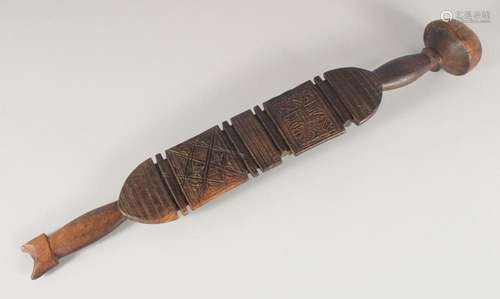 A SOUTH SEAS CARVED CLUB OR PADDLE. 2ft 3ins long.