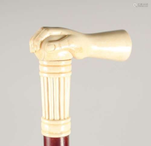 A CARVED BONE HANDLE WALKING STICK,  HAND . 3ft long