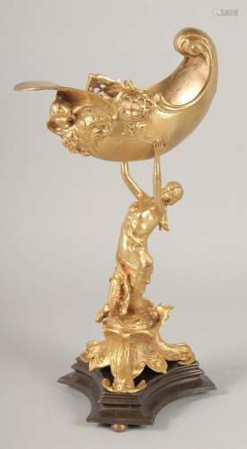 A GILT BRONZE COMPORT, a lady holding a shell on a triangula...