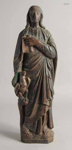AN EARLY CARVED WOOD FLAT BACKED RELIGIOUS FIGURE. 19.5ins l...