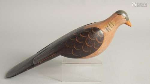 A GOOD PAINTED WOODEN DECOY DUCK. 9ins long.
