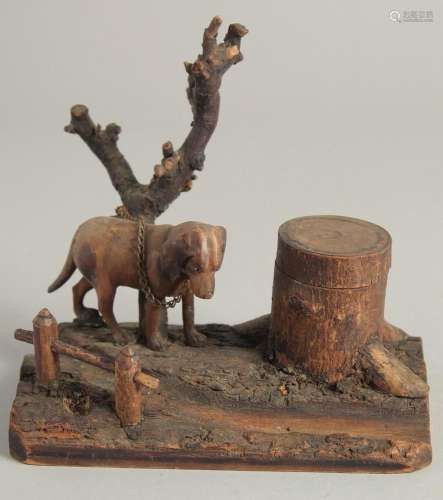 A BLACK FOREST CARVED WOOD "DOG" INKSTAND. 6ins lo...