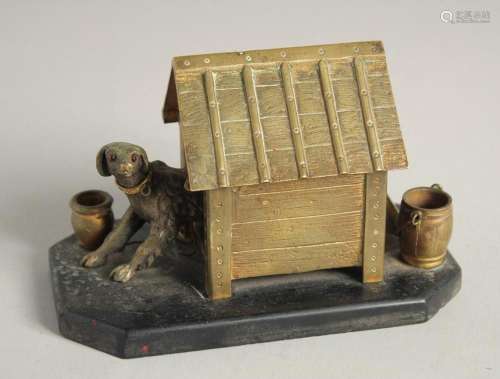 A BRONZE INKWELL, DOG IN A KENNEL on a marble base. 5ins lon...