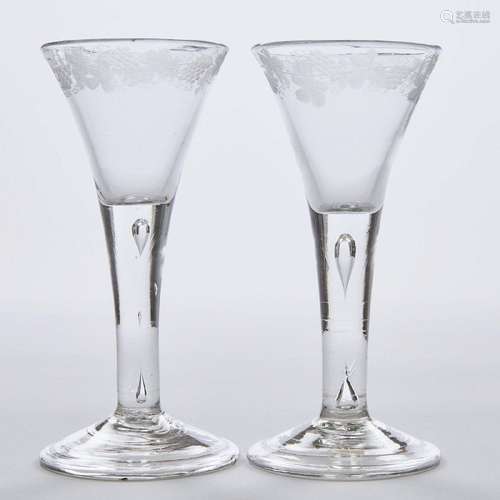 Pair of English Teared Stemmed and Engraved Wine Glasses, c