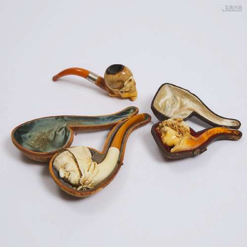 Three Meerschaum Character Pipes, 19th century, longest cas