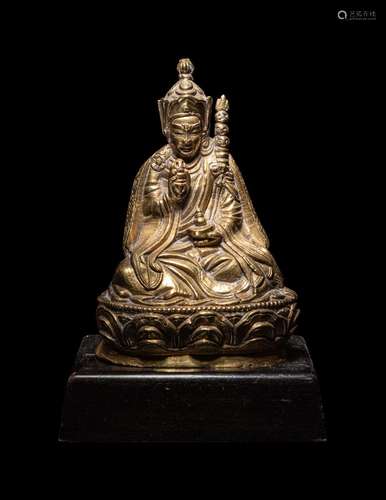 A Tibetan Gilt Bronze Figure of a Priest