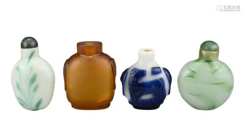 FOUR CHINESE SNUFF BOTTLES. Comprising an amber-coloured gla...