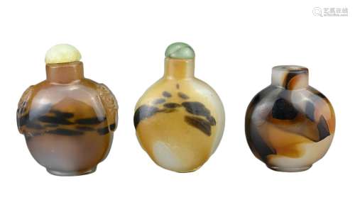 THREE CHINESE SNUFF BOTTLES. Comprising two agate bottles wi...