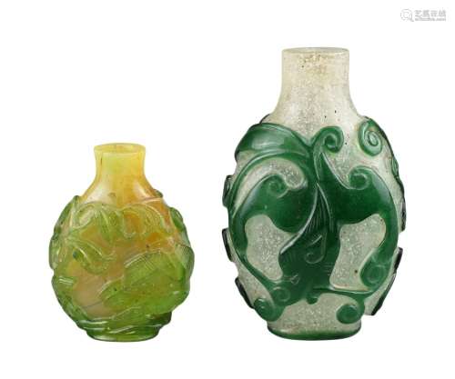 TWO CHINESE GLASS SNUFF BOTTLES. To include a green-overlay ...