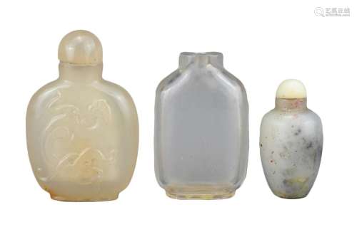 THREE CHINESE SNUFF BOTTLES, QING DYNASTY. Comprising a flat...