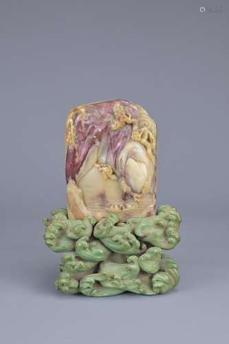 A CHINESE CARVED SOAPSTONE SEAL ON STAND, 19TH CENTURY. Of r...