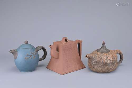 THREE CHINESE YIXING POTTERY TEAPOTS. Of various forms each ...