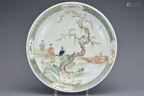 A CHINESE FAMILLE VERTE PORCELAIN DISH. Depicting a garden s...