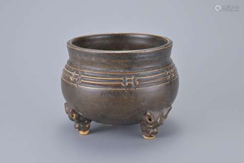 A CHINESE CIZHOU BROWN GLAZED TRIPOD CENSER, 12/13TH CENTURY...