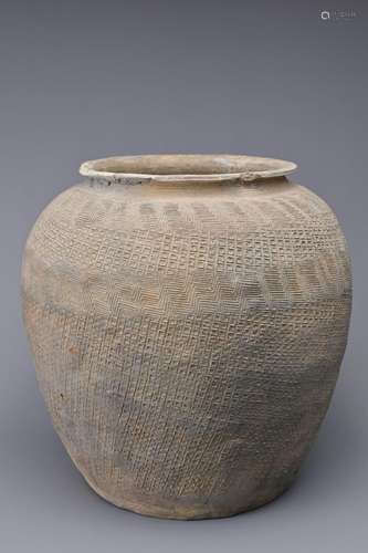 A LARGE CHINESE WARRING STATES IMPRESSED POTTERY JAR. Relati...