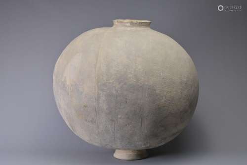 A GIANT CHINESE POTTERY COCOON JAR ?WARRING STATES. Heavily-...